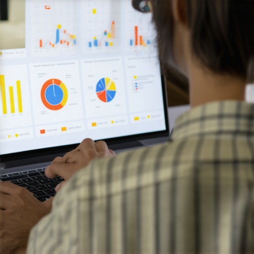Person working on SEO analytics on a laptop showing charts and graphs related to local map rankings.